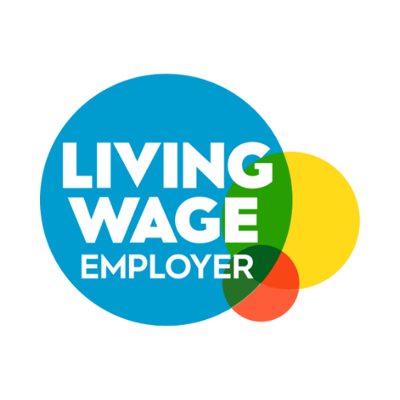 Logo with the words 'Living Wage Employer' in bold white text, placed inside overlapping coloured circles—blue, yellow, green, and red—indicating accreditation as a Living Wage Employer.