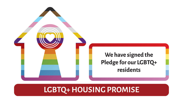Rainbow-colored house icon with a heart symbol, alongside text stating 'We have signed the Pledge for our LGBTQ+ residents' and a red banner reading 'LGBTQ+ Housing Promise'.