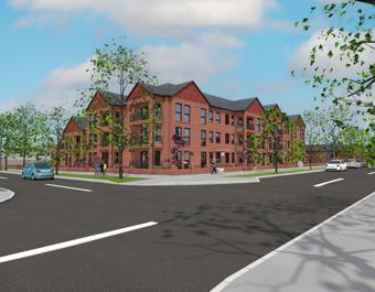 Street corner with a large three-story brick apartment building, surrounded by trees and sidewalks. Several people are walking and cars are visible on the road under a partly cloudy blue sky.