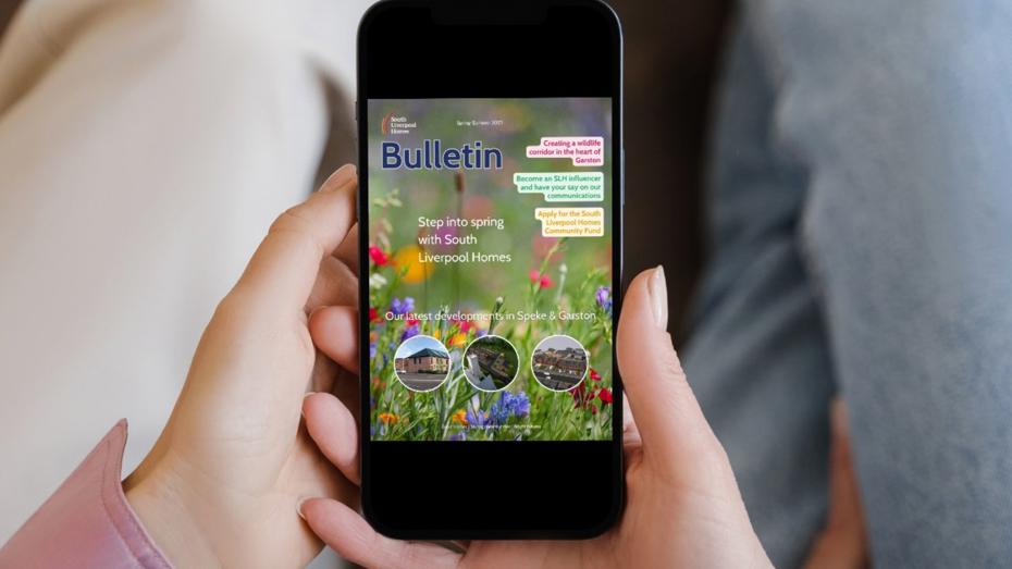 Smartphone displaying a South Liverpool Homes bulletin with spring-themed graphics, housing development updates, and community engagement opportunities, held in hand against a neutral background. Smartphone displaying a South Liverpool Homes bulletin with spring-themed graphics, housing development updates, and community engagement opportunities, held in hand against a neutral background.