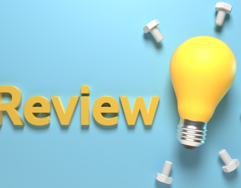 The word “Review” in bold yellow 3D letters on a light blue background, next to a yellow light bulb surrounded by bolts, symbolizing ideas and constructive evaluation.