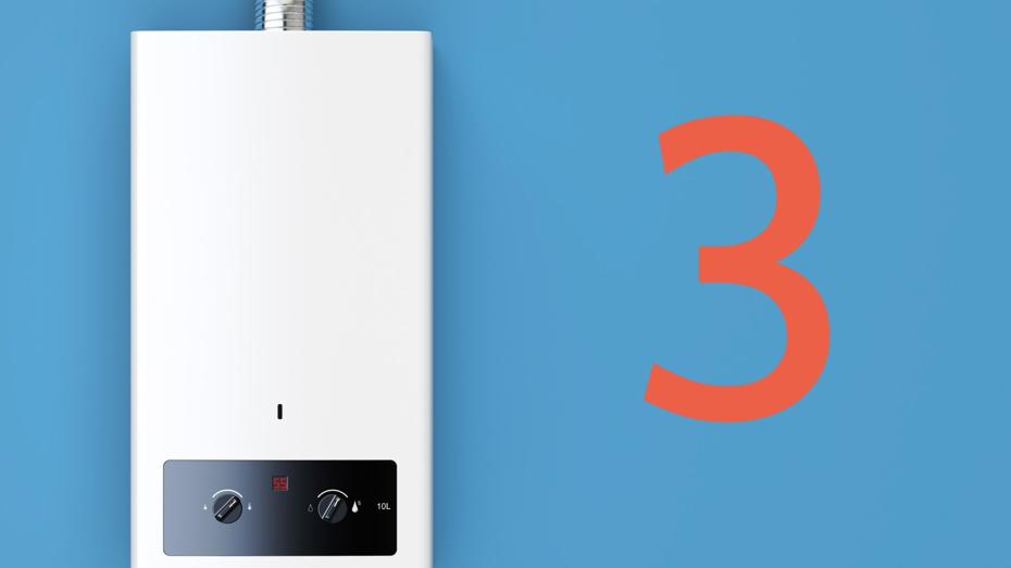 "White tankless water heater mounted on a blue wall, displaying '55' in red digital text, with two control knobs on the front panel and a vent pipe at the top. A large number '3' is visible to the right "White tankless water heater mounted on a blue wall, displaying '55' in red digital text, with two control knobs on the front panel and a vent pipe at the top. A large number '3' is visible to the right
