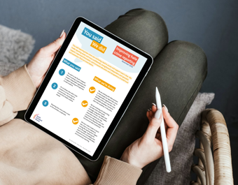Person sitting with a tablet, holding a stylus pen, viewing a “You said, we did” update titled “Improving hate crime reporting” with sections outlining feedback and actions taken.