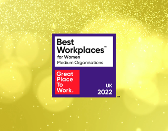 Badge reading 'Best Workplaces for Women Medium Organisations' with 'Great Place To Work' logo and 'UK 2022' on a celebratory yellow background with sparkles.