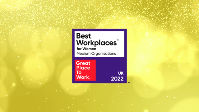 Badge reading 'Best Workplaces for Women Medium Organisations' with 'Great Place To Work' logo and 'UK 2022' on a celebratory yellow background with sparkles.