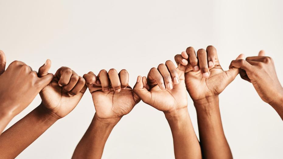 Group of hands linking pinkie fingers in unity, symbolising trust, connection, and access to community safety resources and support. Group of hands linking pinkie fingers in unity, symbolising trust, connection, and access to community safety resources and support.