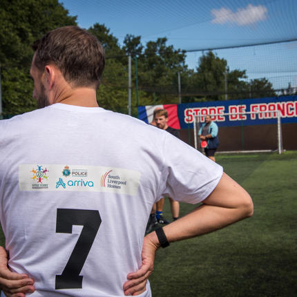 The back view of a football top featuring the number 7 and the logos of The Venny, Arriva, Merseyside Police and South Liverpool Homes.