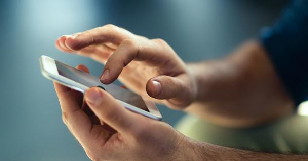 Close-up of hands using a smartphone, suggesting digital communication.