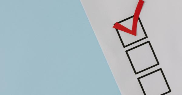A piece of paper with three vertically arranged checkboxes on a light blue background; the top checkbox is marked with a red checkmark, while the other two are empty.