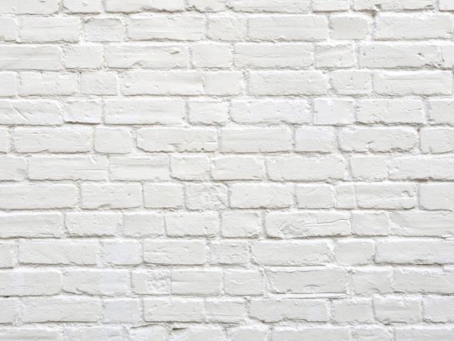 White painted exterior wall. White painted exterior wall.